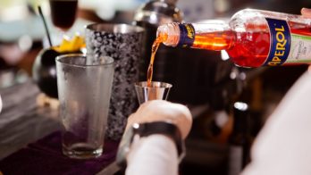 barman-in-white-shirt-pouring-drink