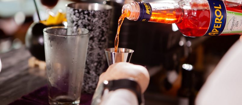 barman-in-white-shirt-pouring-drink